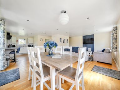 A living room with a dining area and kitchen at Lodge 4 near Brigg
