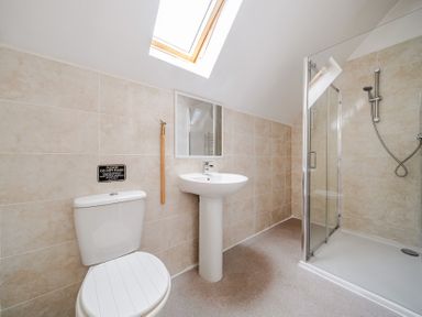 A bathroom with a shower and wash basin at Lodge 4 Near Brigg