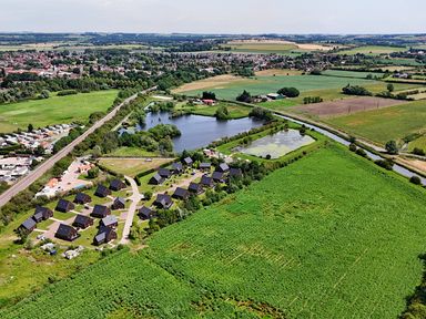 An aerial view of houses and a lake at Lodge 4 near Brigg