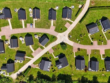 An aerial view of a residential area with houses and pathways at Lodge 4 Near Brigg