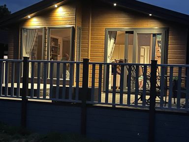 A deck with outdoor furniture at Yorkshire view lodge in Wilberfoss