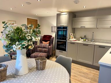 A kitchen with a dining table and chairs at Cottage - Sleeps 2 - Garden in Coleford