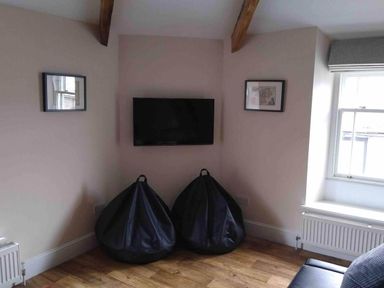 A living room with bean bags and a TV at Sedbergh Penthouse - KingBed - Tv - Wifi in Sedbergh