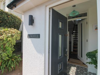 An entrance with a door and staircase at Lorrell in Salcombe