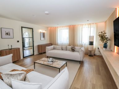 A living room with a coffee table and sofa at Brynseion Uchaf near Aberystwyth