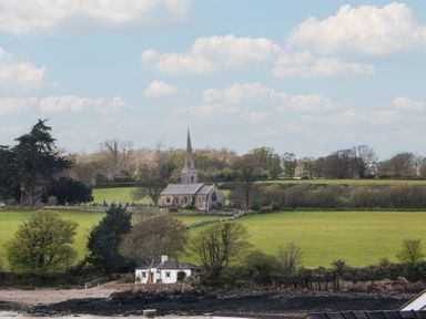 A church and house in a field at Seaview in Y Felinheli