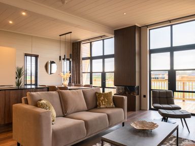 A living room with a sofa and coffee table at Exclusive Tempest Spa in Grimsby