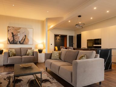 A living room with a sofa and coffee table at Exclusive Tempest Spa in Grimsby