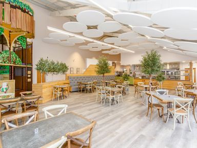 A cafeteria with tables and trees at Pine Lodge Spa Carlton Miniott near Thirsk