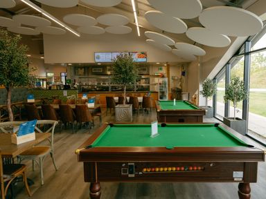 A dining room with pool tables and seating area at Pine Lodge Spa Carlton Miniott near Thirsk