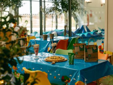 A dining room with a table set for children at Pine Lodge Spa in Carlton Miniott near Thirsk