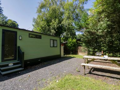 An outdoor area with a mobile home and picnic table at 51 Calgarth Park, Troutbeck