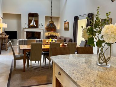 A dining room with a table and chairs at The Chimney in Bamburgh