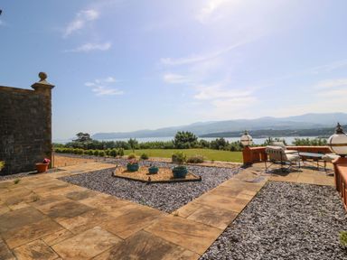 An outdoor area with a patio and view at Apartment 1, Bryn Mel Manor in Menai Bridge