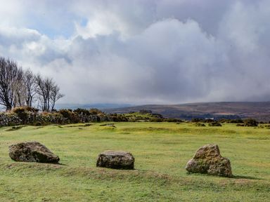 A landscape with rocks and trees at The Mill Barn in Lustleigh