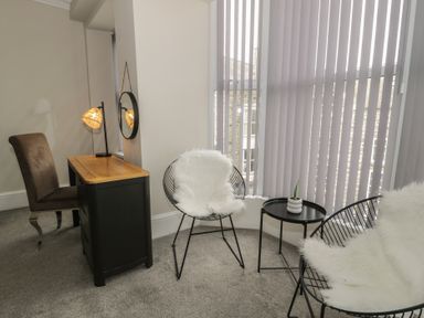 An office with a desk and chairs at Llety Cllyd in Barmouth