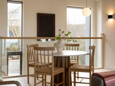 A dining room with a table and chairs at Clifftop House Hot Tub St Ives