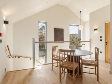 A dining room with a table and chairs at Clifftop House Hot Tub in St Ives