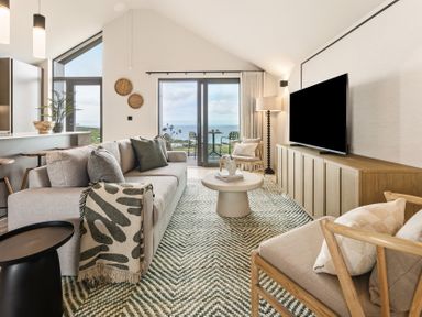 A living room with a sofa and table at tbc in St. Ives