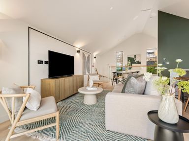 A living room with a television and sofa at tbc St. Ives
