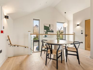 A dining room with a table and chairs at tbc in St. Ives