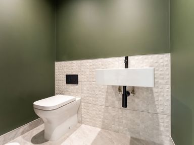 A bathroom with a toilet and sink at tbc in St. Ives