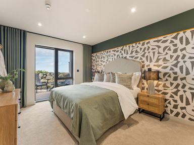 A bedroom with a bed and window at tbc in St. Ives
