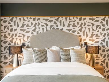 A bedroom with a bed and bedside tables at tbc in St. Ives