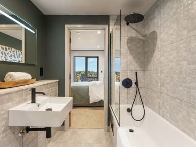 A bathroom with a sink, shower, and bathtub at tbc in St. Ives