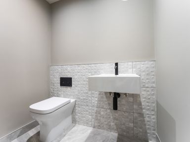 A bathroom with a toilet and sink at tbc in St. Ives