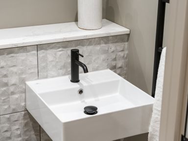 A sink with a black faucet in a bathroom at tbc in St. Ives