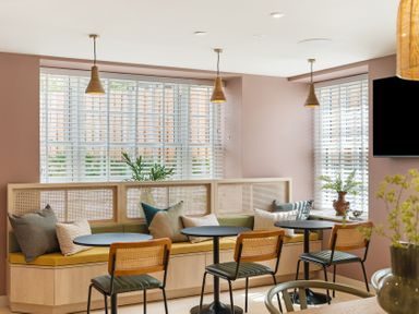 A dining room with tables and chairs at Hidden 3- Sea Terrace House in St Ives