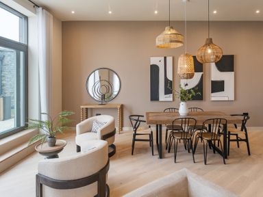 A dining room with a table and chairs at tbc in St. Ives