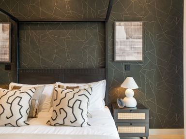 A bedroom with a bed and pillows at tbc in St. Ives