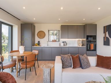 A kitchen with a round table and chairs at tbc in St. Ives