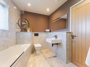 A bathroom with a bathtub sink and toilet at tbc in St. Ives