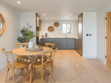 A dining room with a table and chairs at The Old Barn in St. Ives