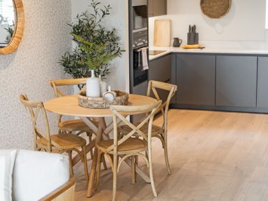 A dining area with a round table and chairs at tbc in St. Ives