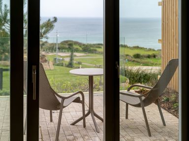 An outdoor area with chairs and a table at tbc in St. Ives