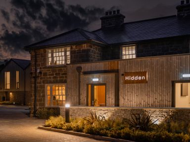 A building exterior with a sign at Hidden 19- Coastal Hot Tub in St Ives