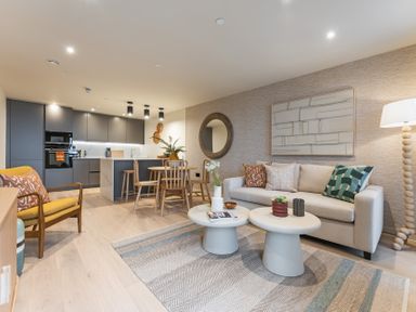 A living room with furniture and kitchen area at Hidden 19- Coastal Hot Tub St Ives