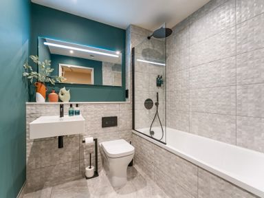 A bathroom with a shower and bathtub at Hidden 19- Coastal Hot Tub, St Ives