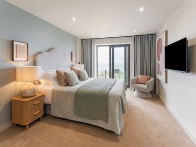 A bedroom with a bed and nightstand at tbc in St. Ives