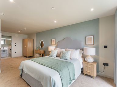 A bedroom with a bed and bedside tables at The Old Barn in St. Ives