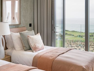 A bedroom with two beds and a view at tbc St. Ives