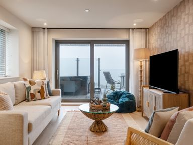 A living room with a sofa and coffee table at tbc in St. Ives