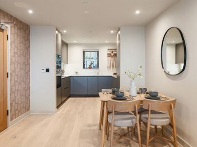 A dining area with a table and chairs in a kitchen at tbc in St. Ives
