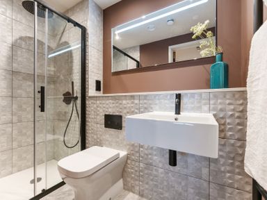 A bathroom with shower, toilet, and sink at The Old Barn in St. Ives