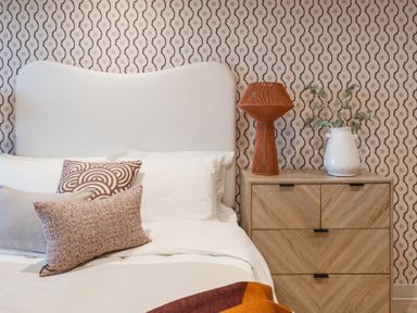 A bedroom with a bed and a nightstand at tbc in St. Ives