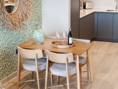 A dining room with a table and chairs at tbc in St. Ives